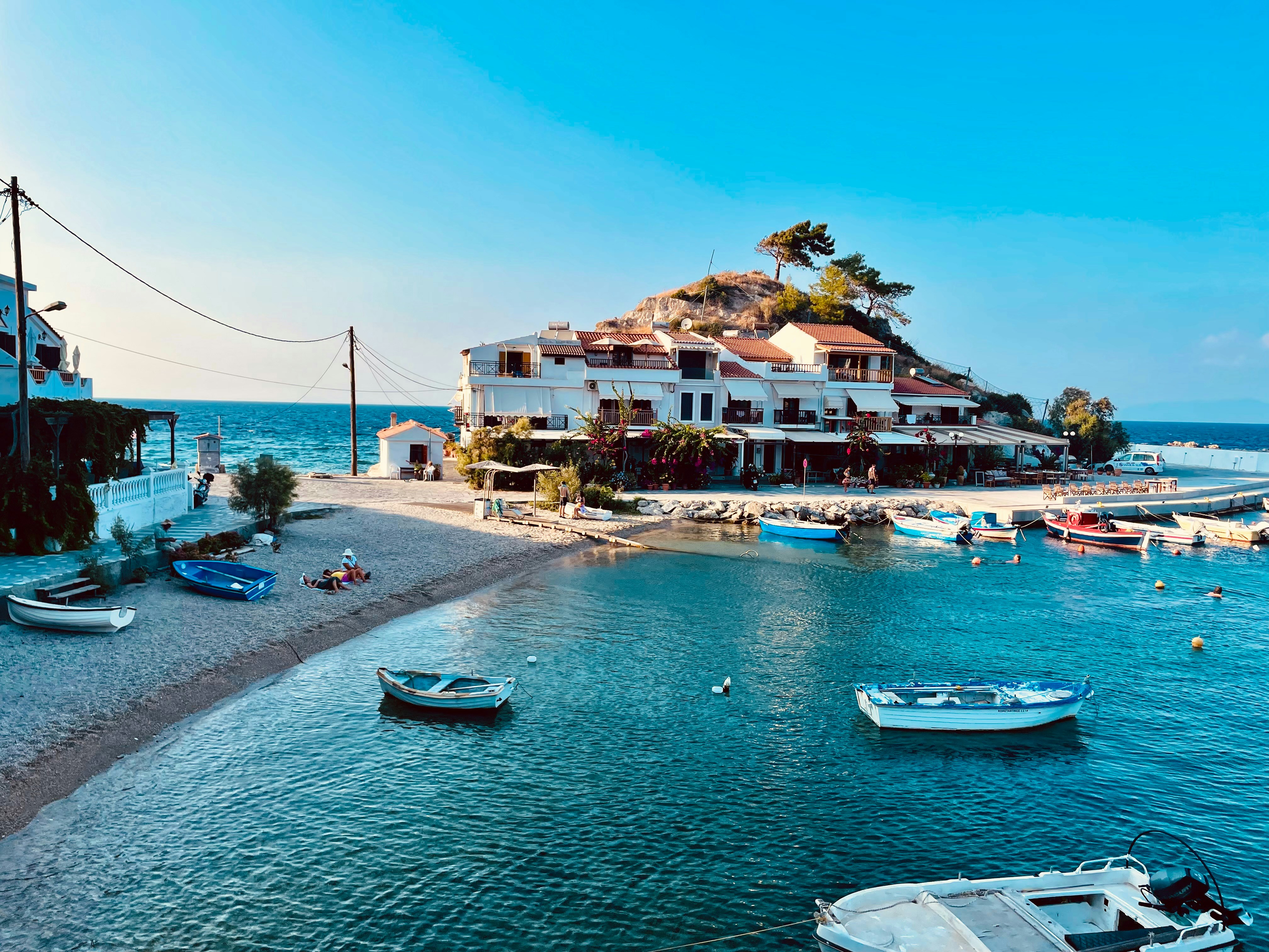 Boats in a serene coastal village harbor
