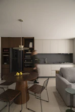 Modern kitchen and dining area with person walking