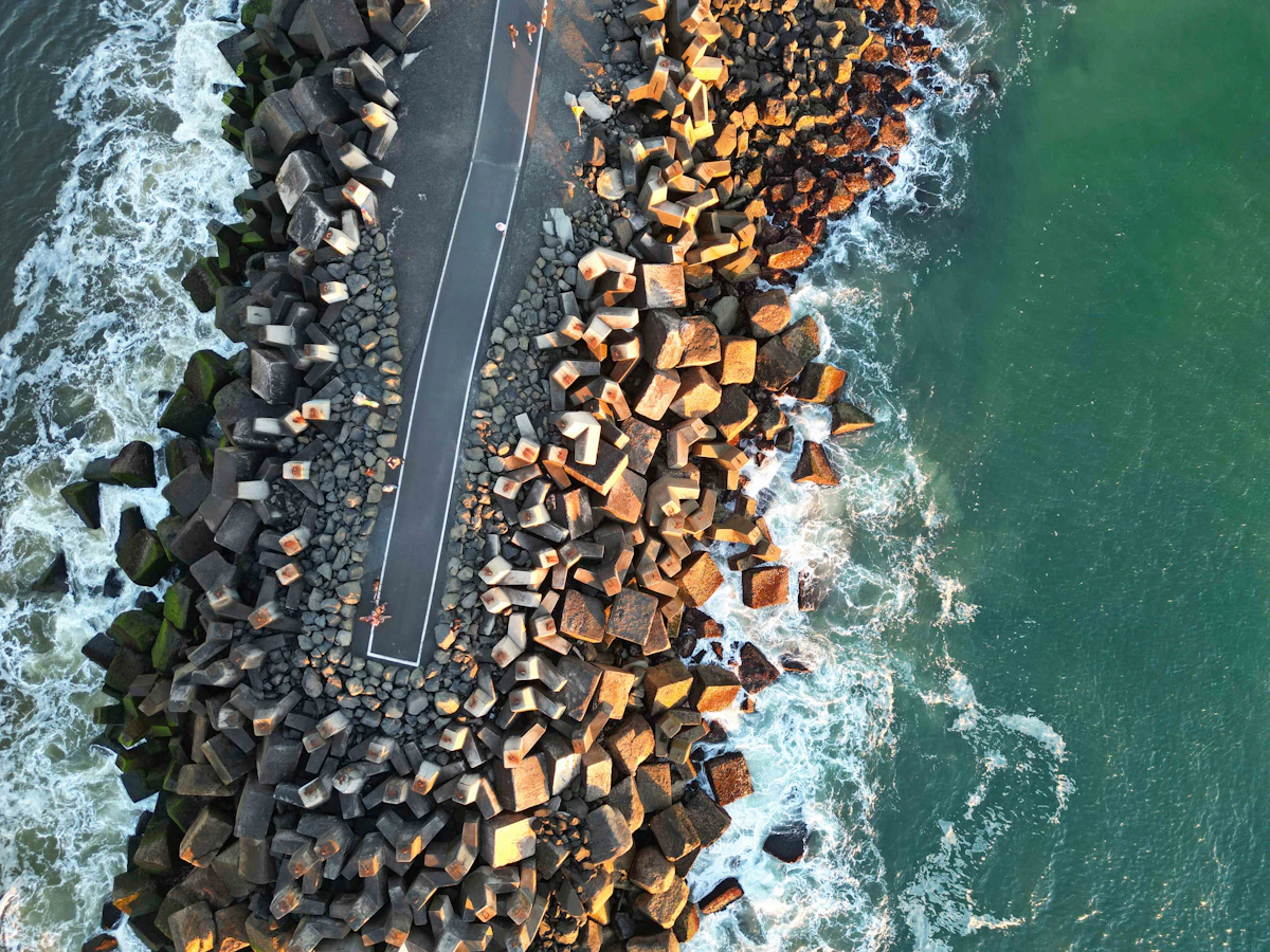 Concrete cap seawall holding back coastal waves