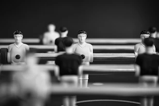 Foosball players lined up on a table