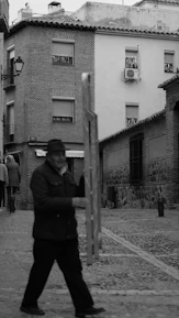 Man walking with a large wooden frame