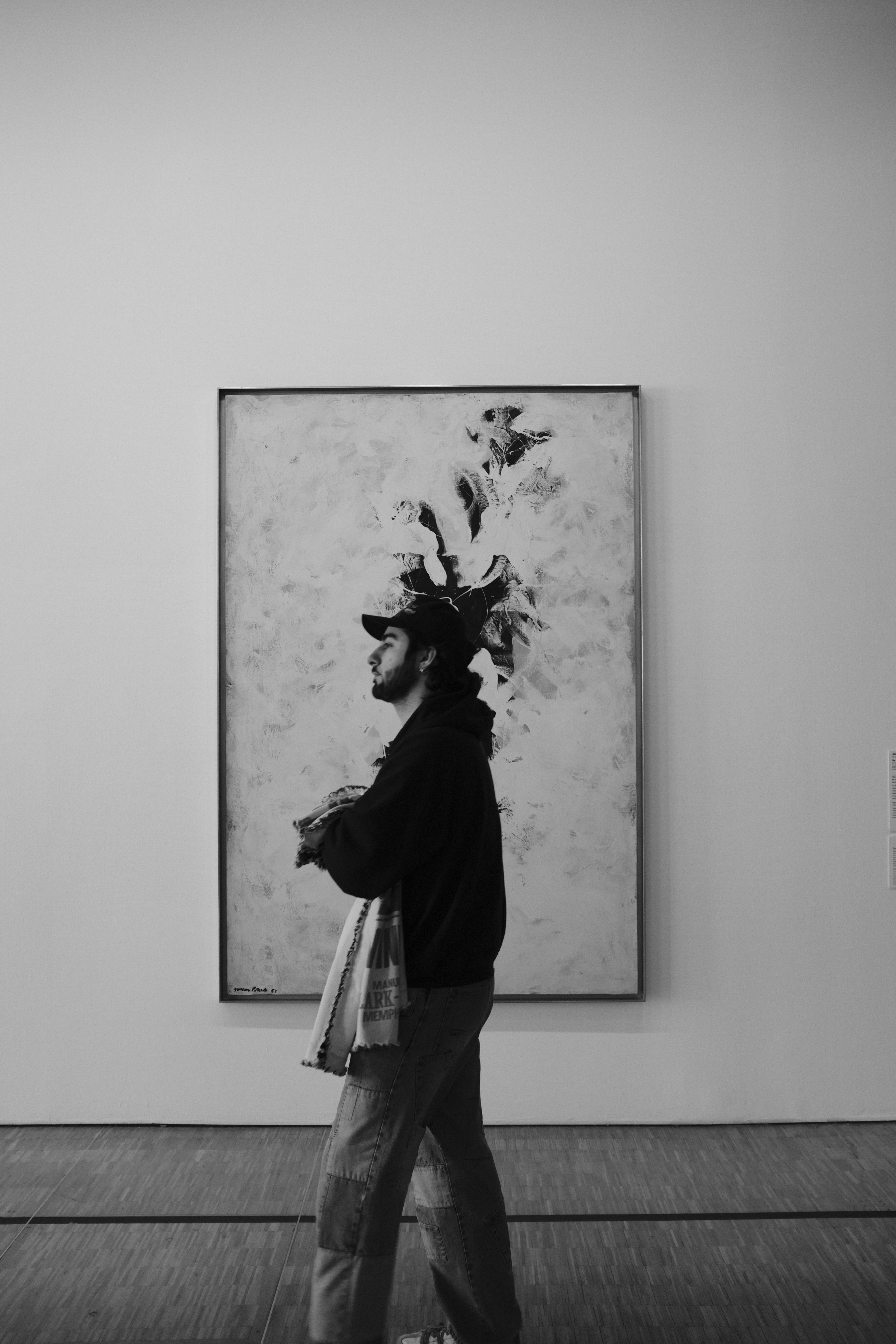 Man in profile looking at abstract art