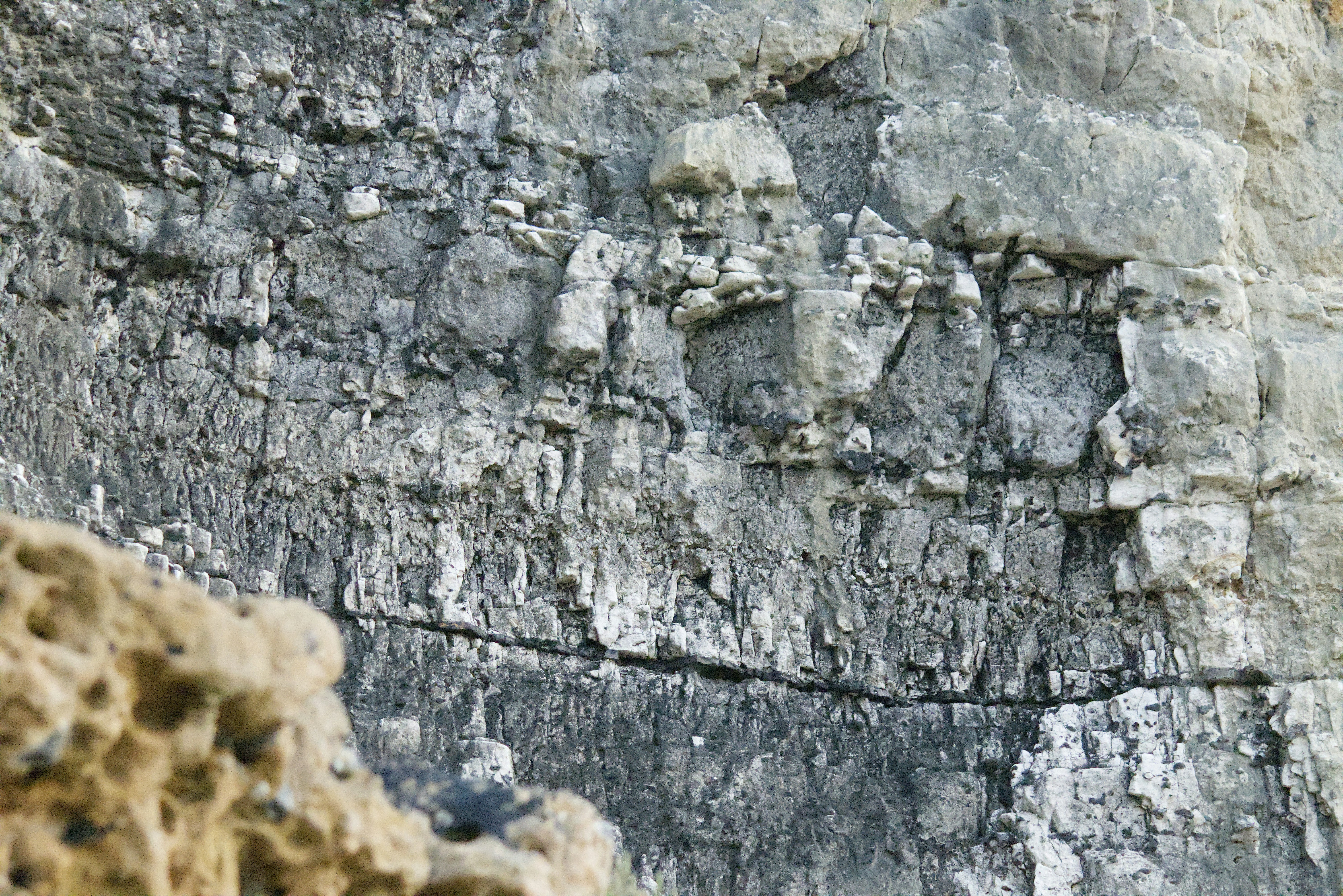 Layered rock formations with visible strata and texture