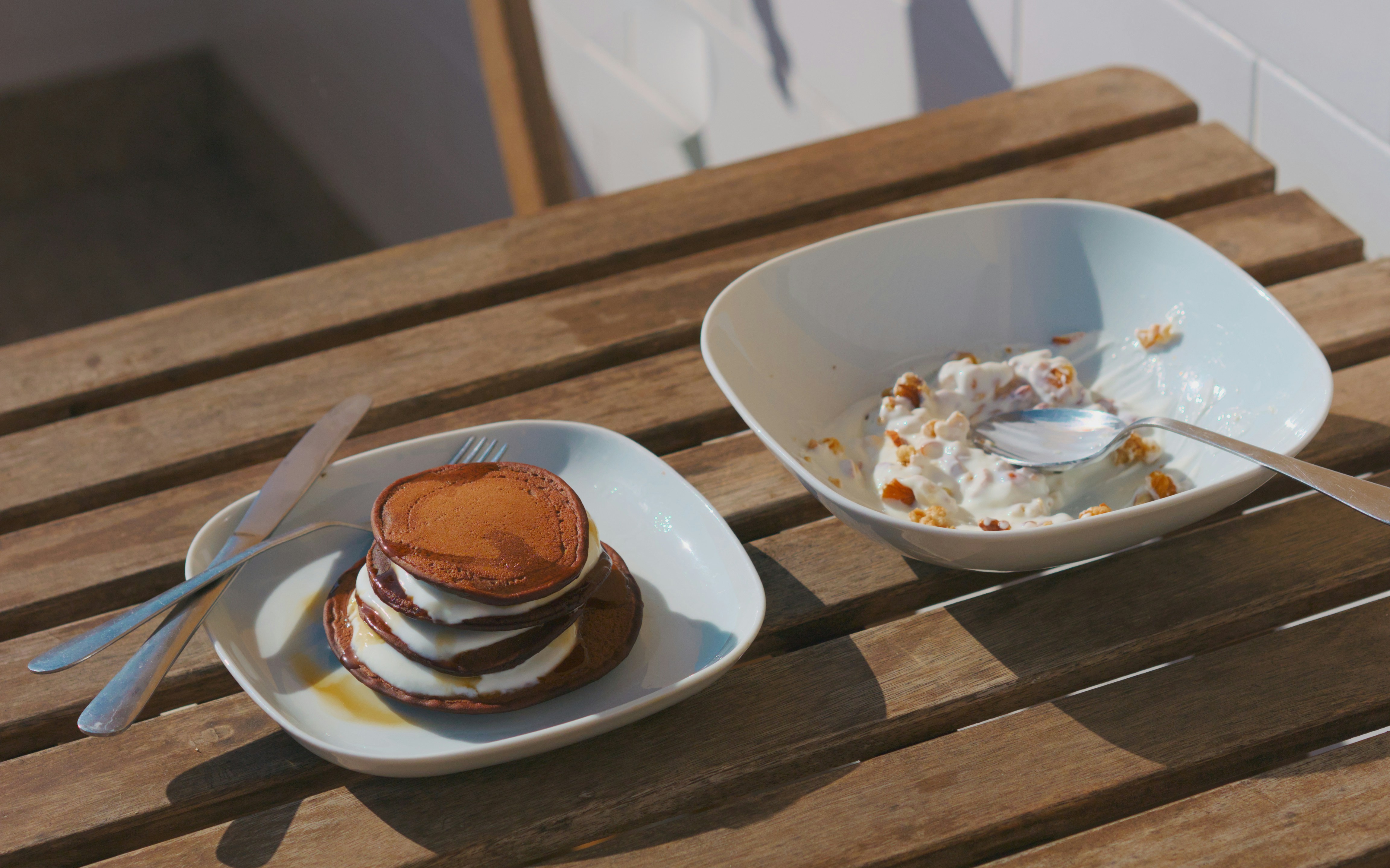Pancakes on an outdoor wooden table