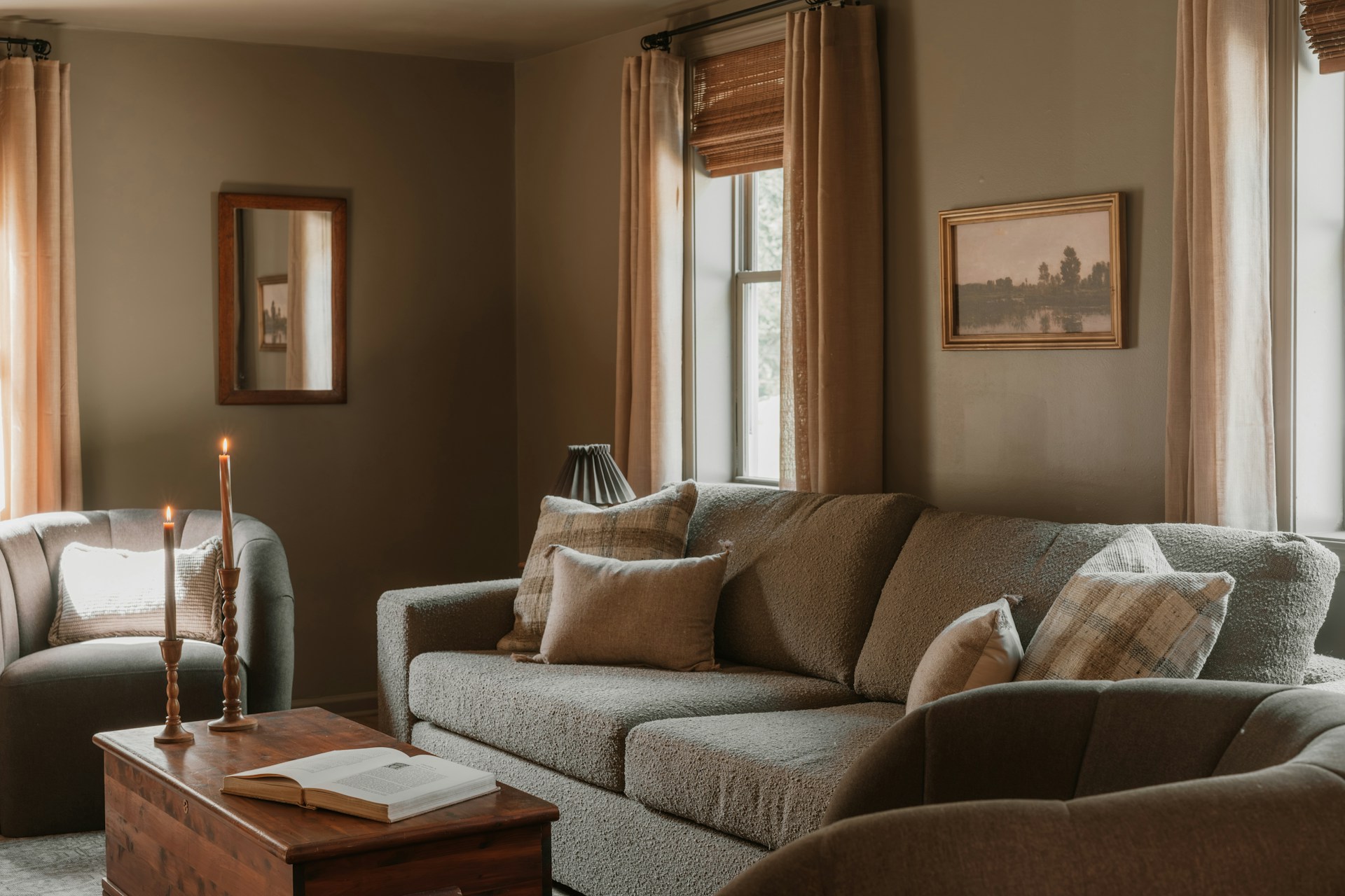 A cozy living room with a sofa and armchair.