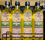 Four bottles of conscious food groundnut oil
