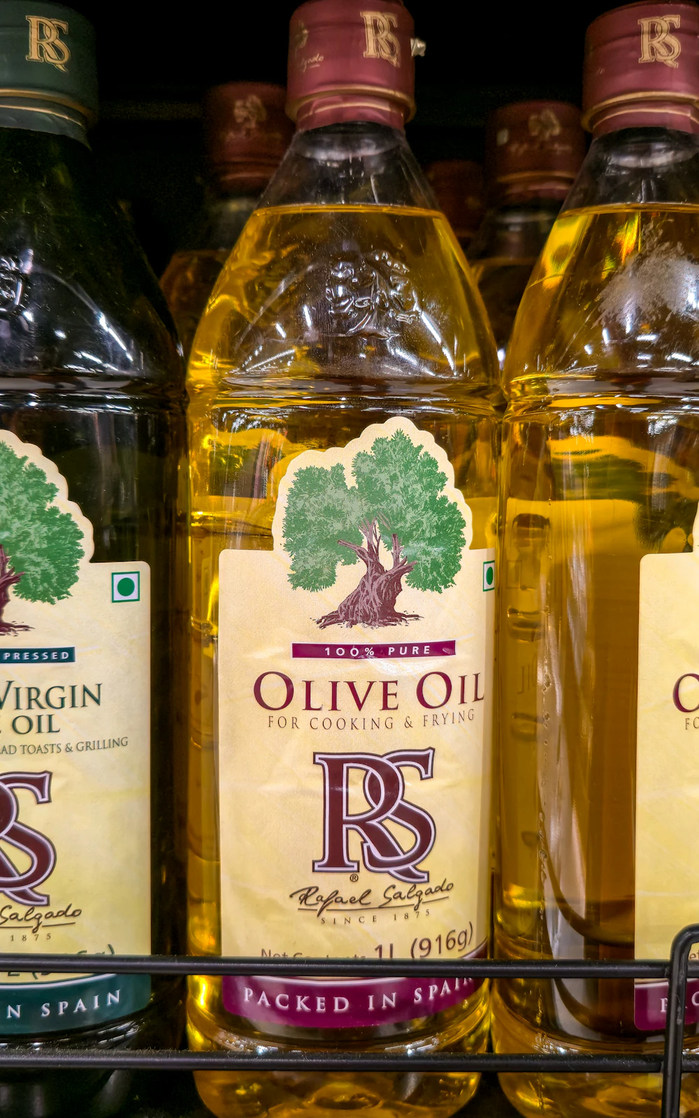 Bottles of frying oil arranged on a shelf