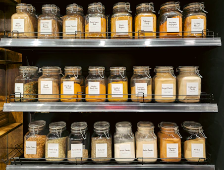 Jars of spices and seasonings neatly arranged on shelves