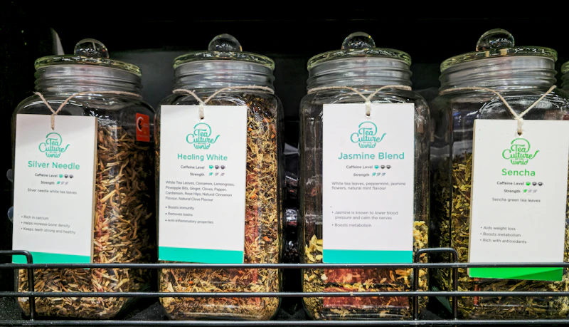 glass jars filled with dried herbs and spices