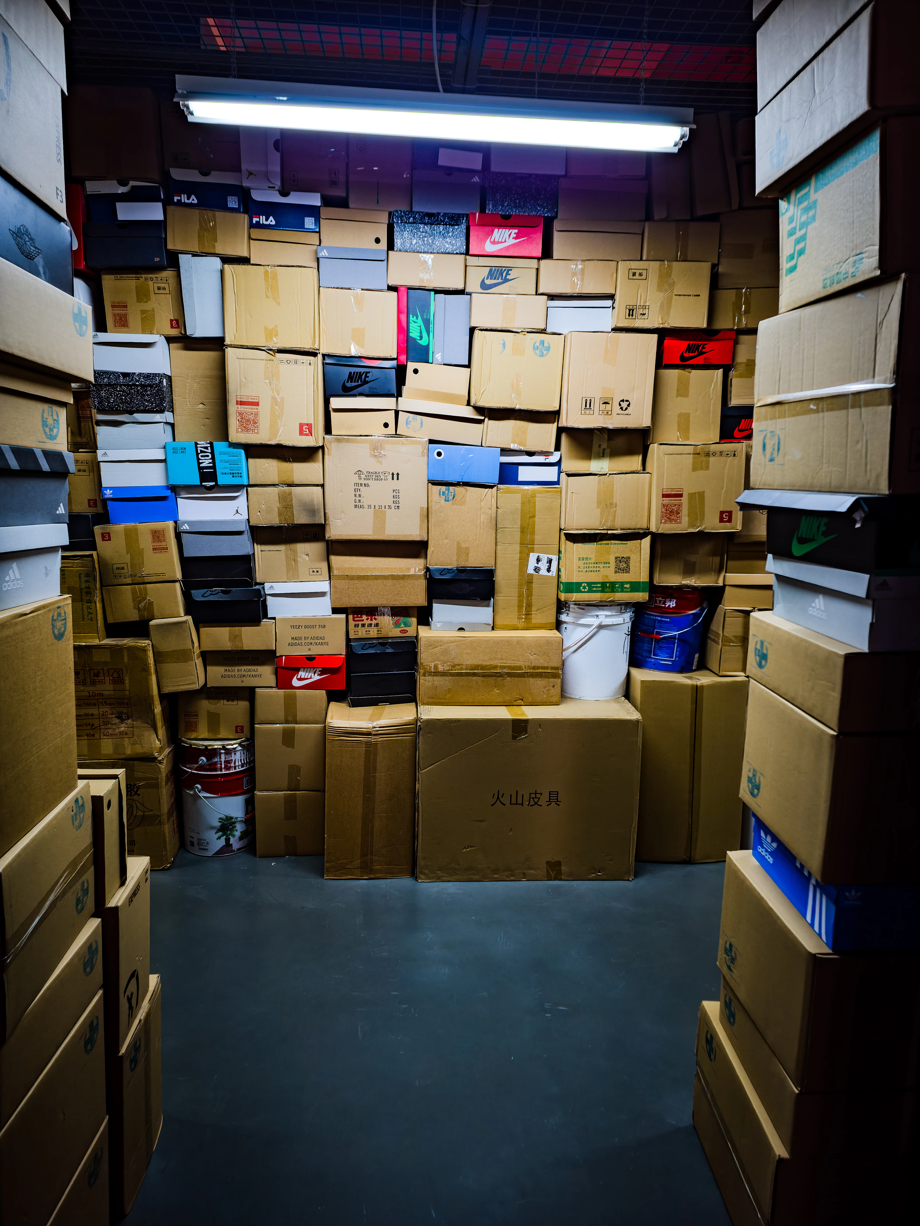 Room stacked with packed and labelled cartons before moving day
