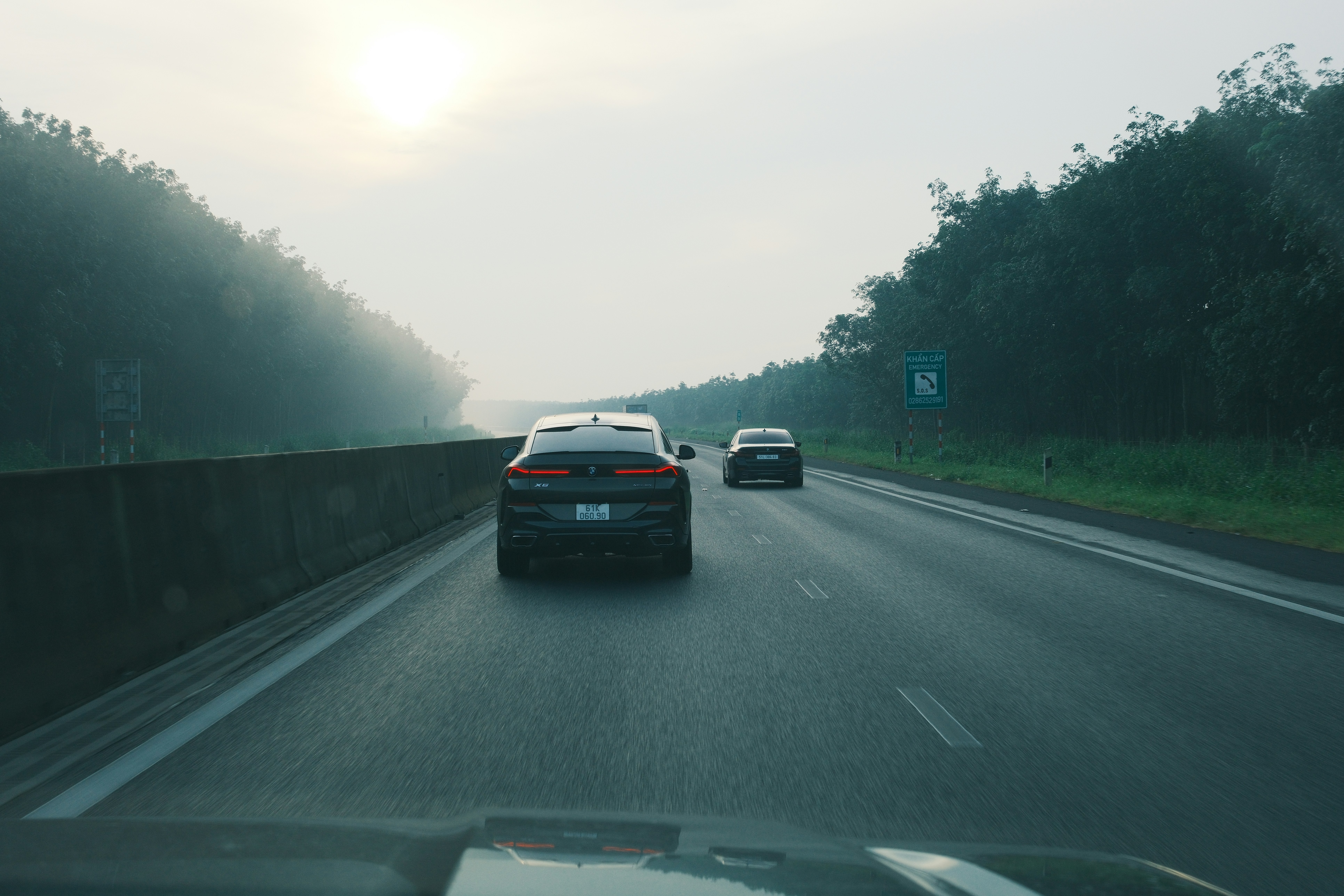 Family-size electric SUV driving through a modern city street