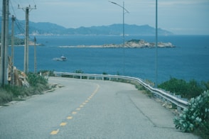 Coastal road with ocean and distant islands