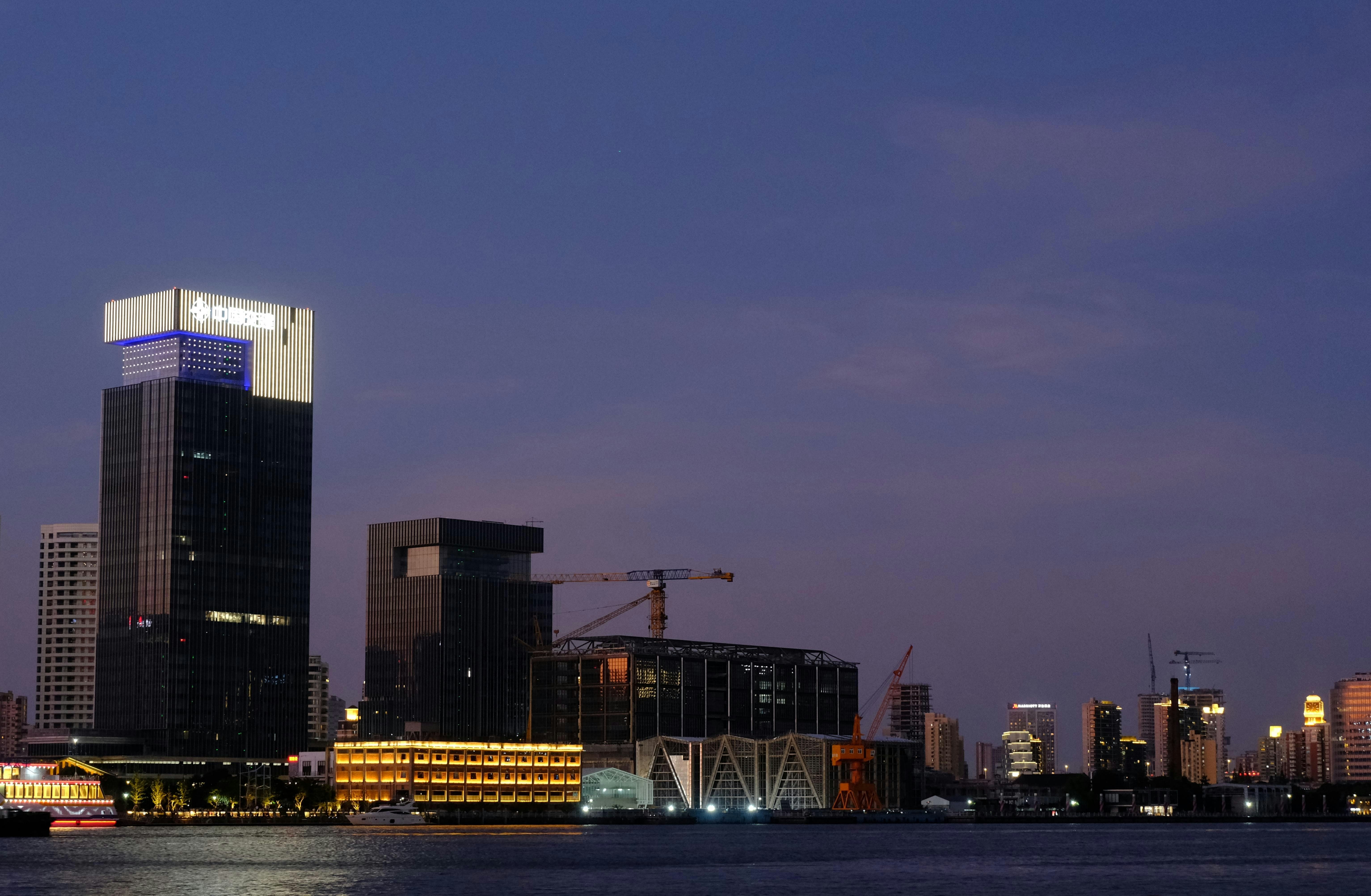 Modern city skyline at dusk over water