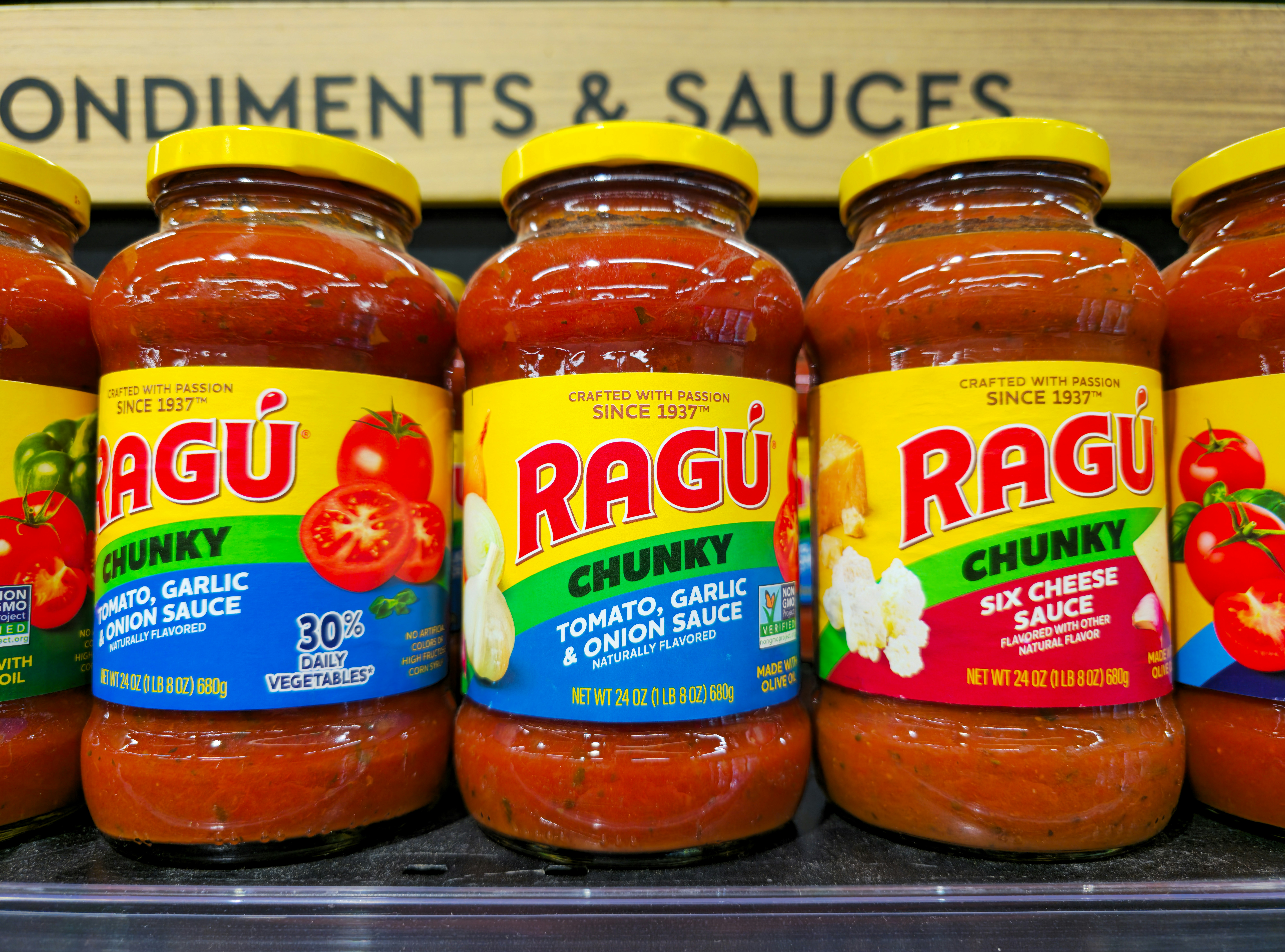 Jars of ragu chunky pasta sauce on shelf
