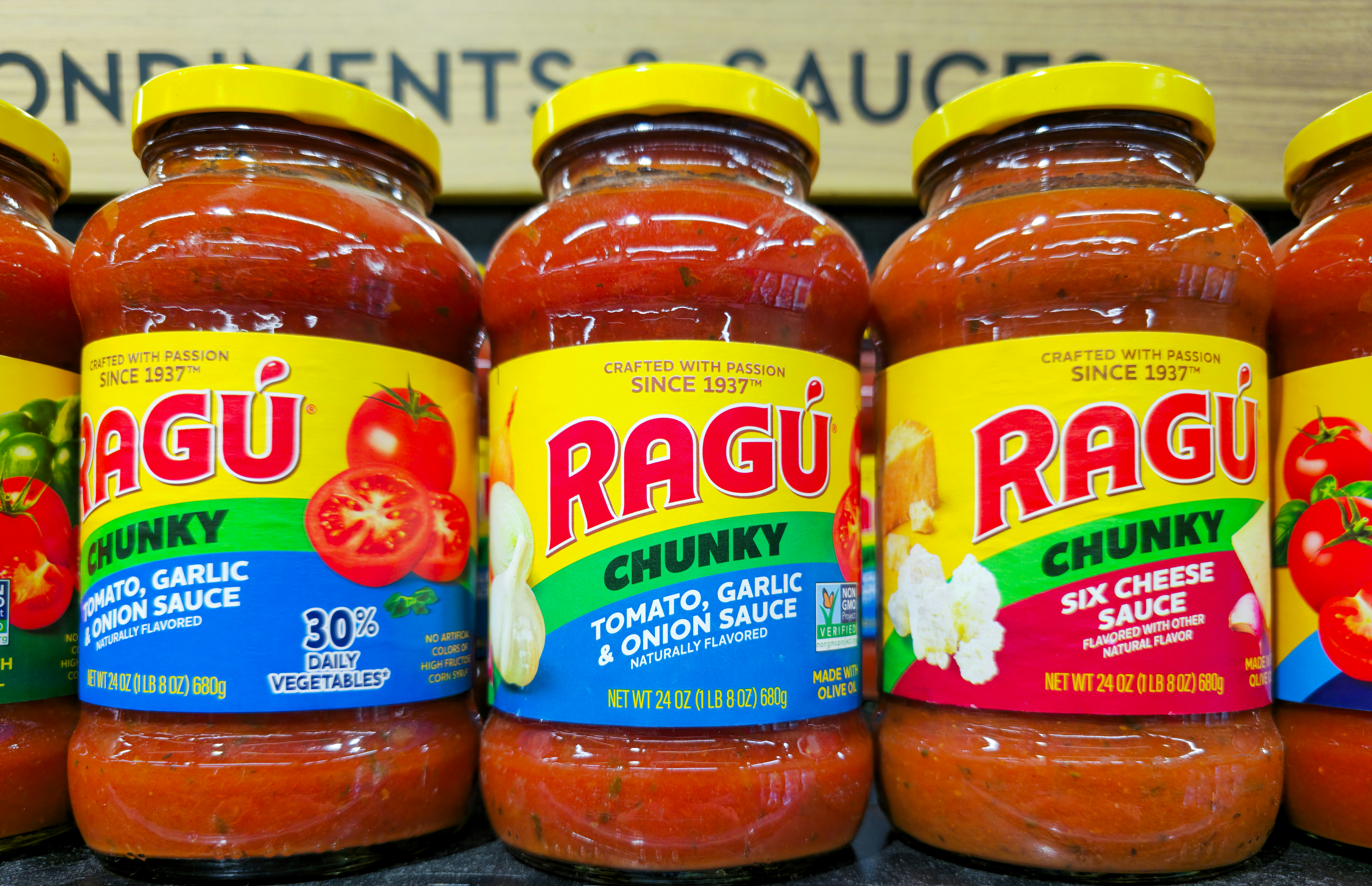 Several jars of ragu chunky tomato sauce.