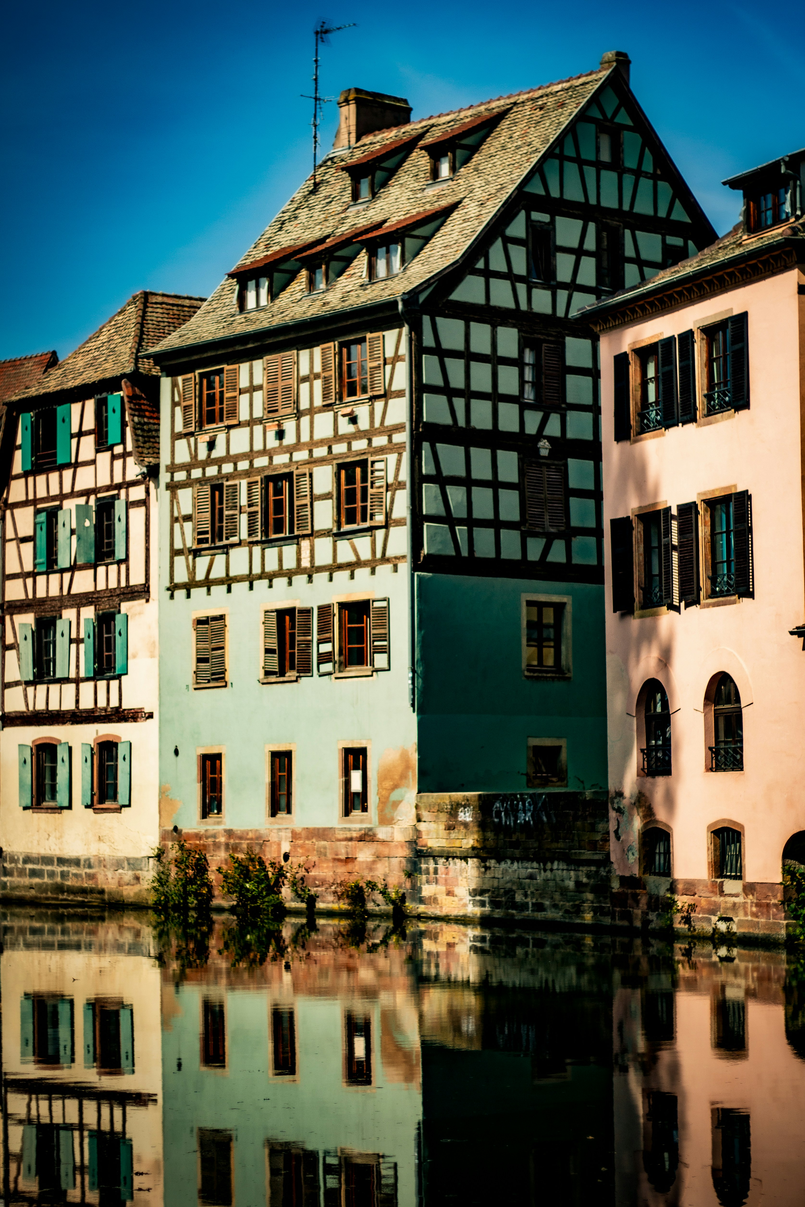 Colorful old buildings reflected in the water