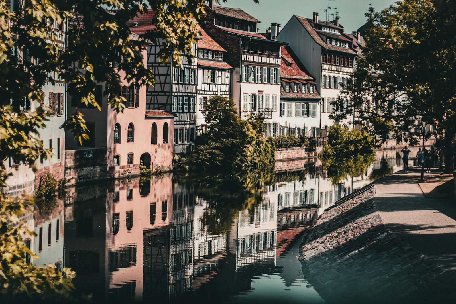 Historic buildings reflected in a calm canal waterway
