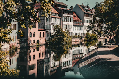 Historic buildings reflected in a calm canal waterway