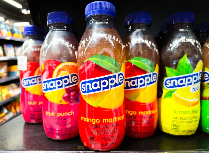 Bottles of snapple juice on a shelf