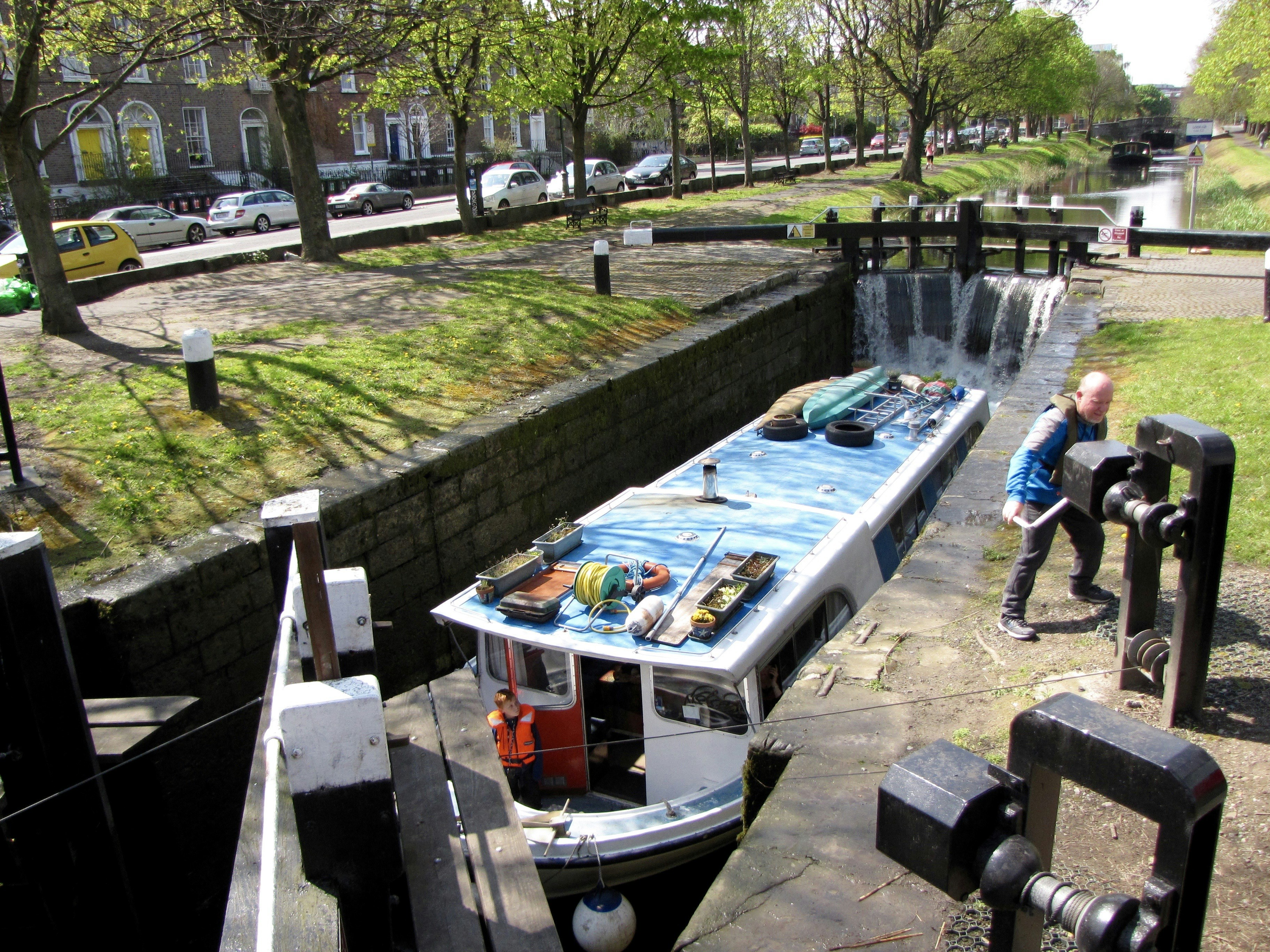 Narrowboat being raised in a canal lock