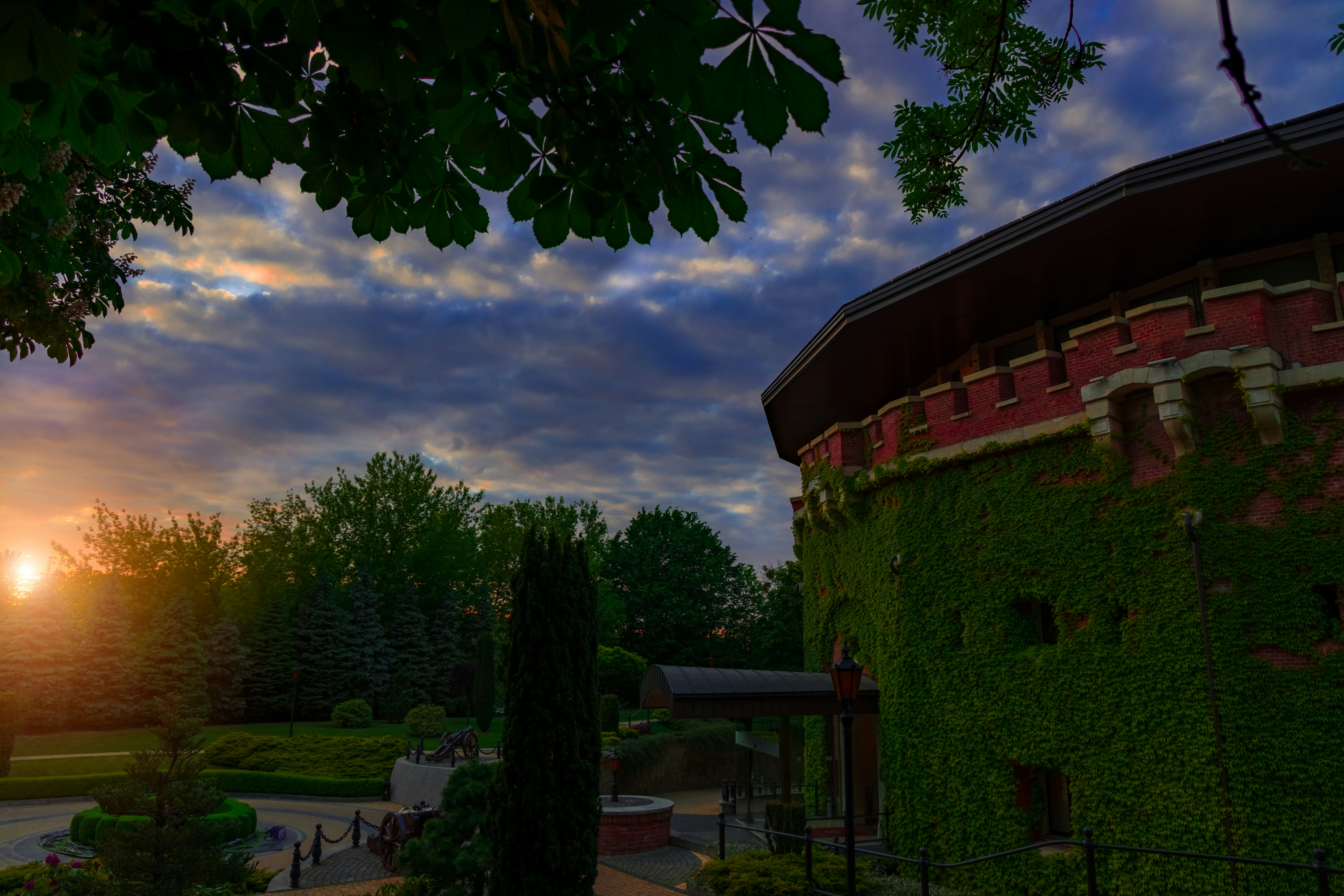 Sunset over a historic ivy-covered building