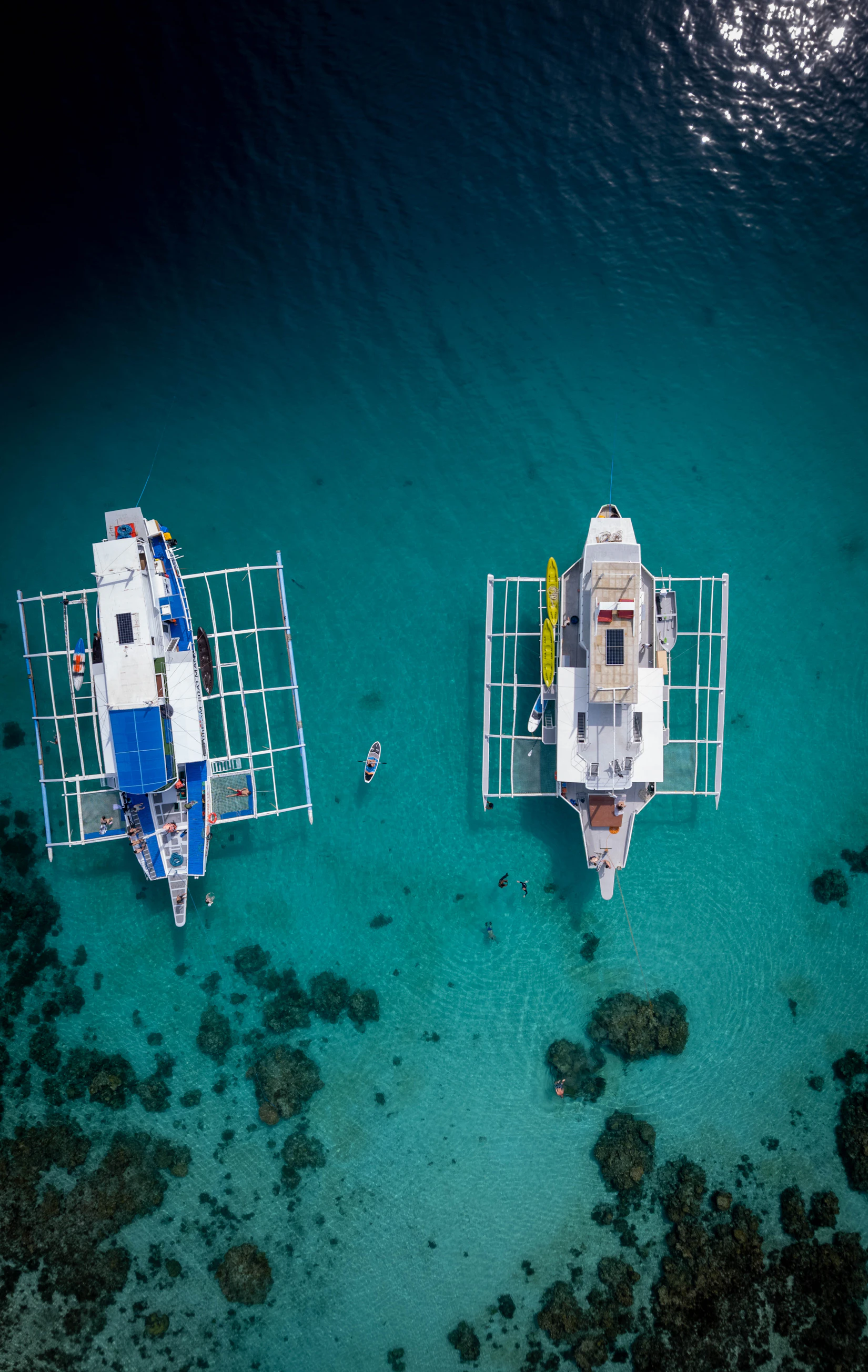 Tropical beach with boats and turquoise water