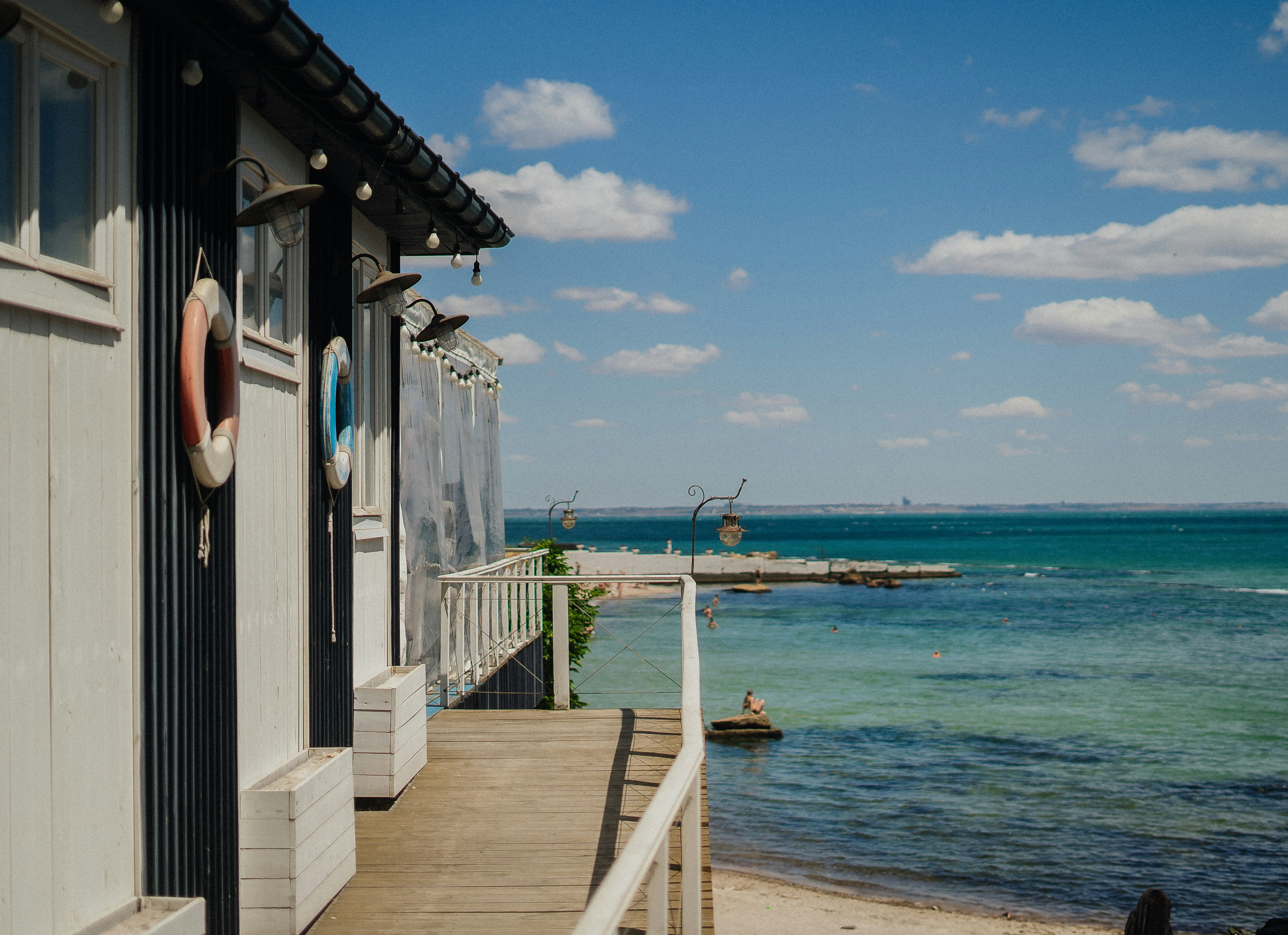 Beachside building with ocean view and life preservers