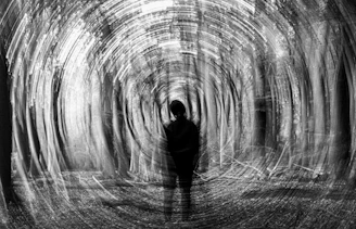 Silhouetted figure in a swirling, abstract forest
