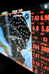 Nautical navigation screen displaying charts and data.