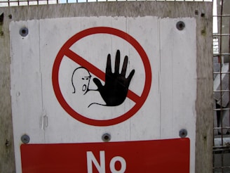 Stop sign with hand symbol and person symbol