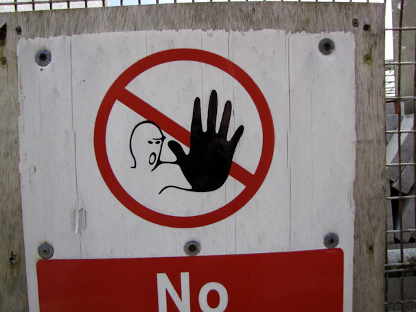 Stop sign with hand symbol and person symbol