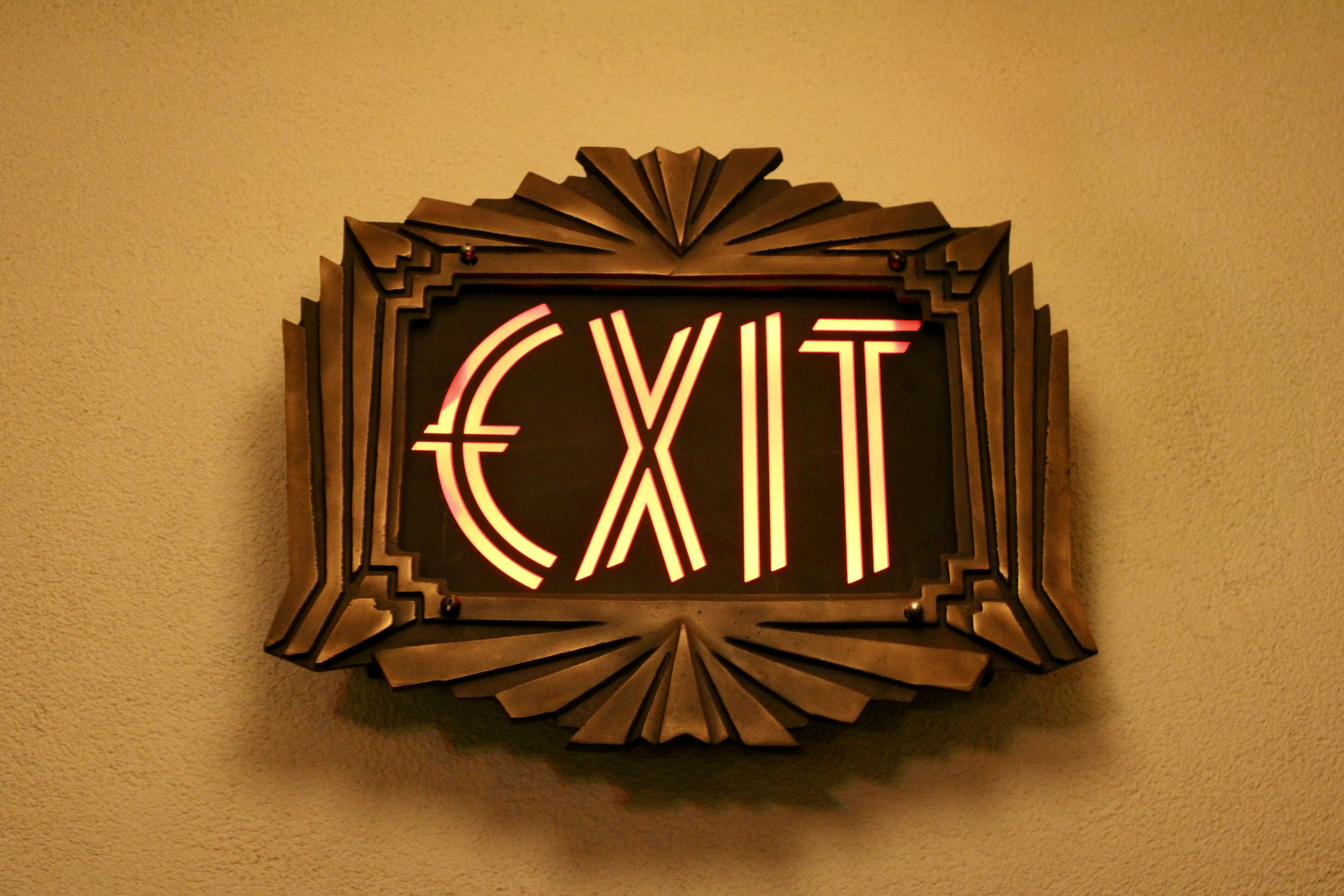 Art deco exit sign with illuminated letters