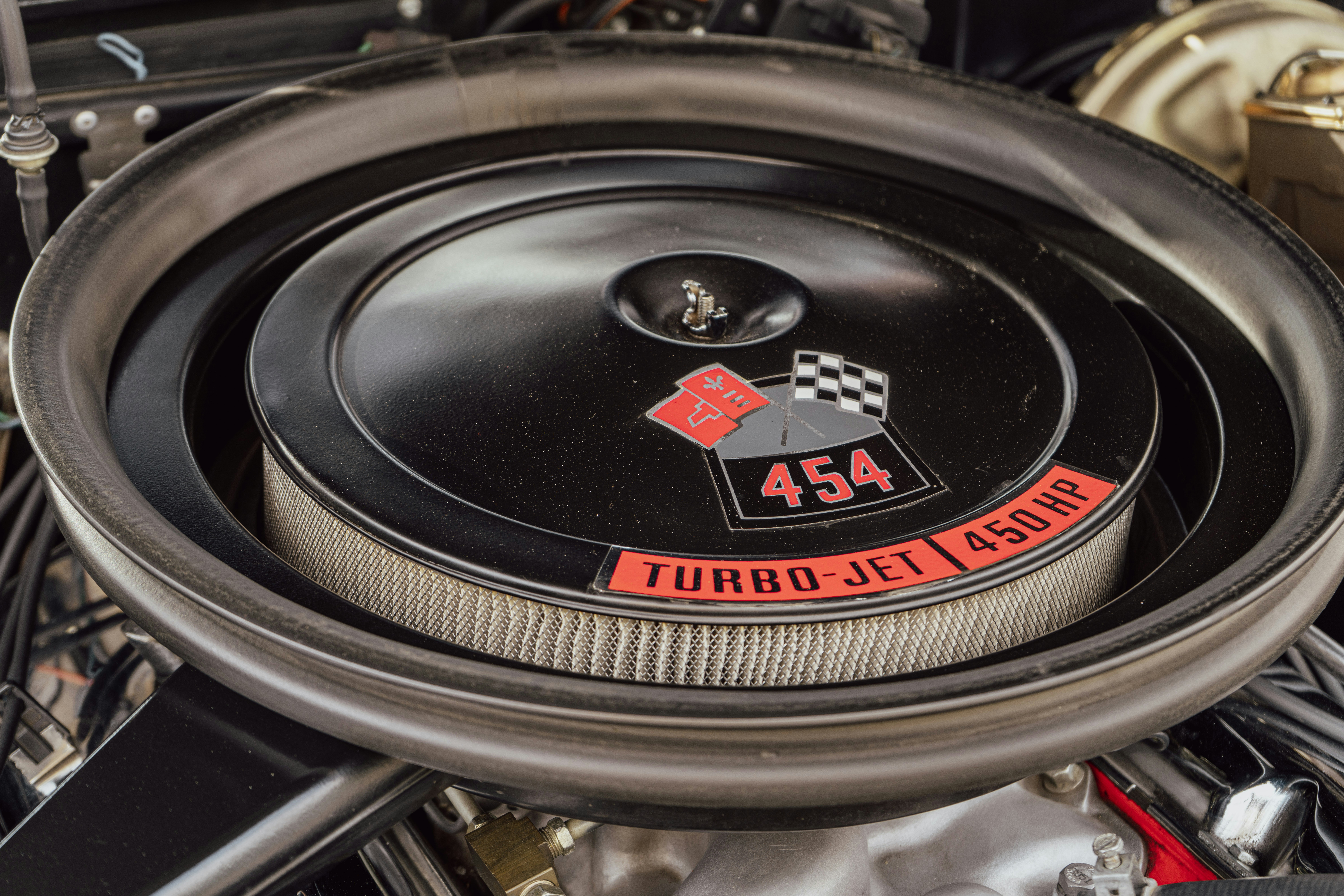 Close-up of a vintage car engine air filter.