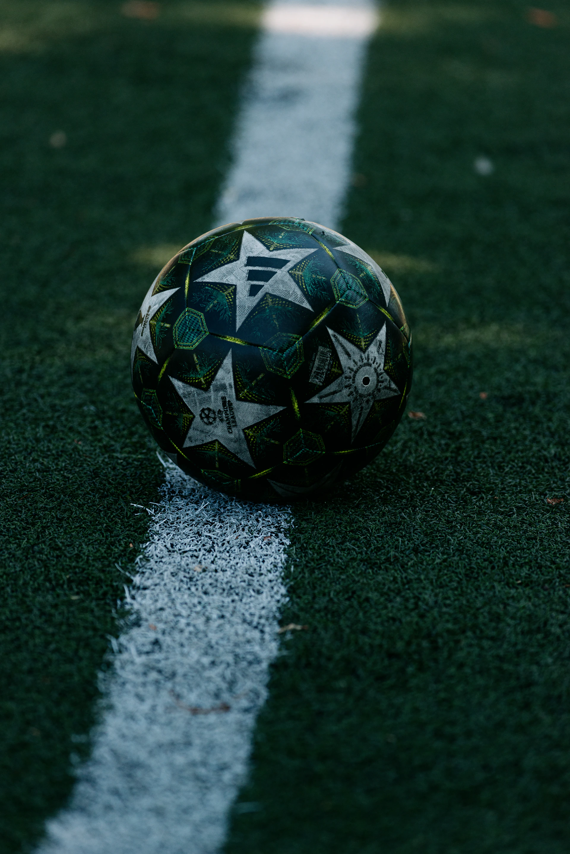 Soccer ball with star pattern on field line