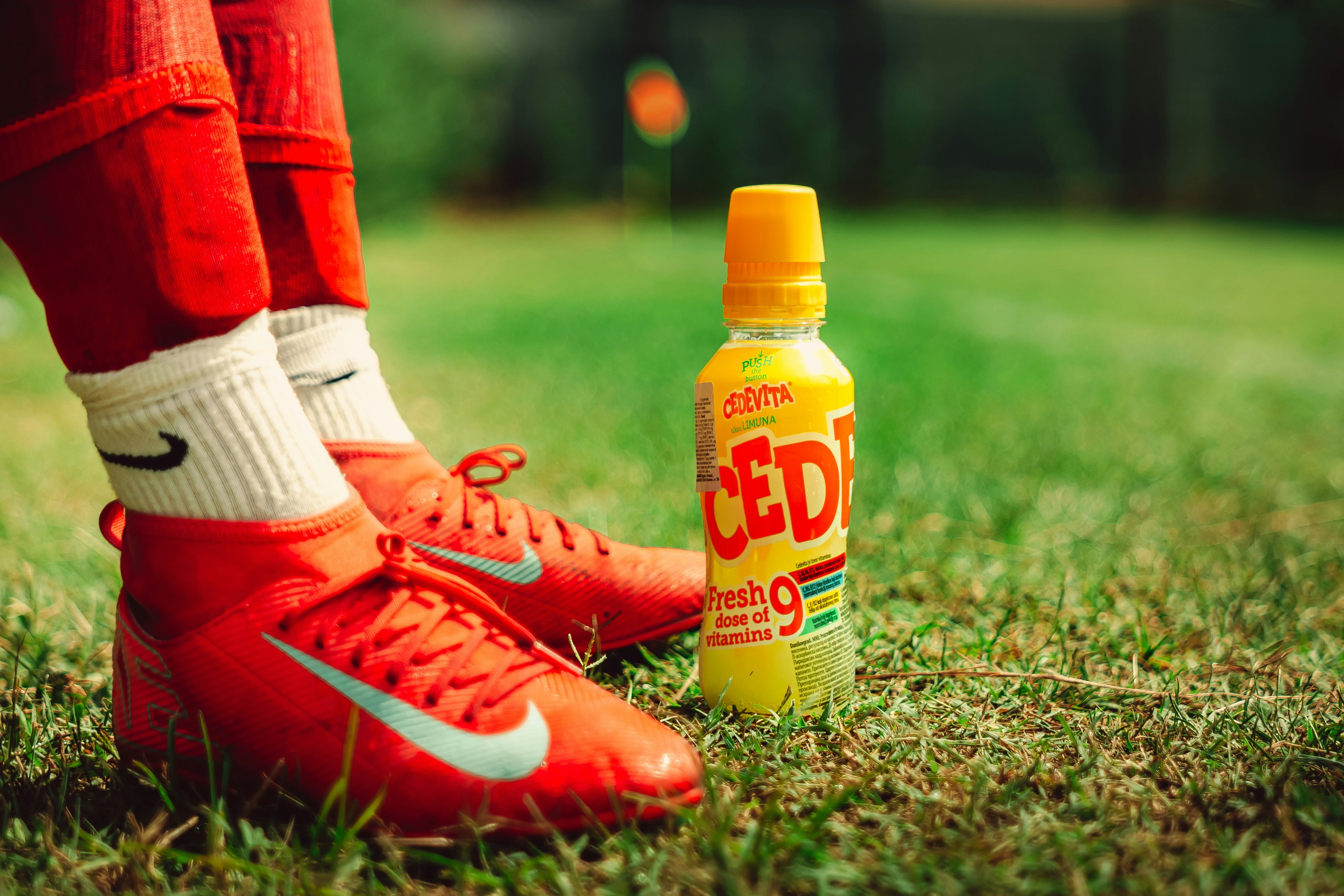 Health-conscious athlete selecting Club-Mate for health-conscious use from cooler, comparing natural yerba mate to artificial energy drinks