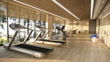 Modern gym with treadmills and large windows