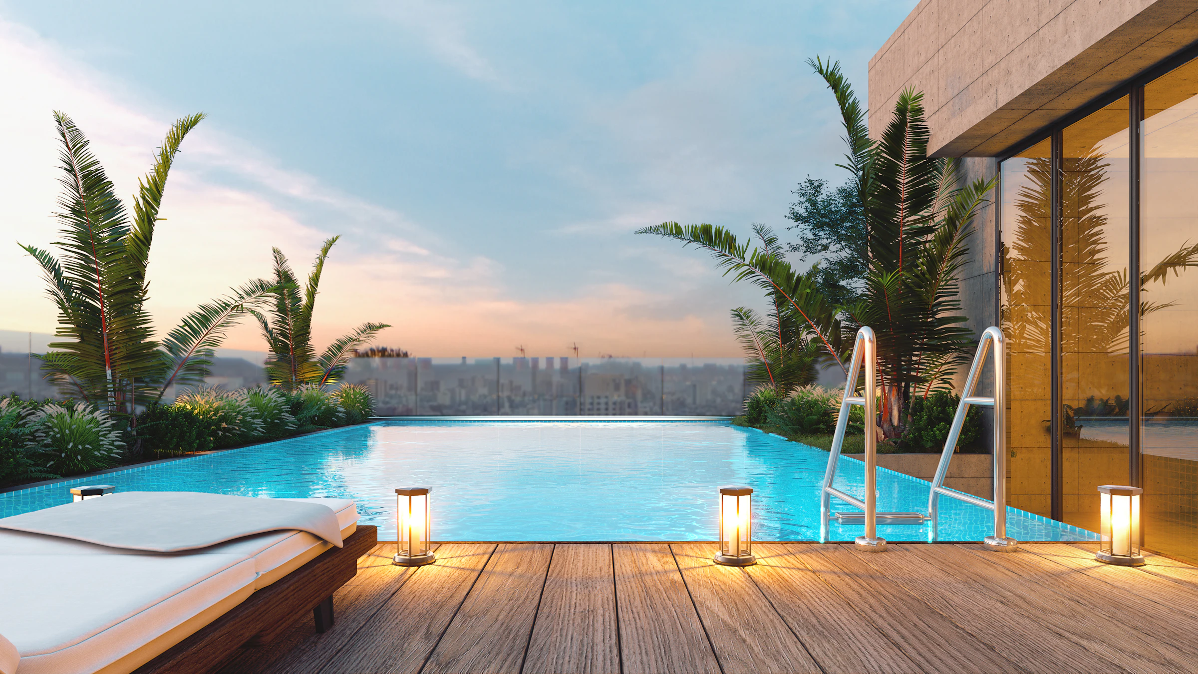 A rooftop pool and lounge chair at sunset