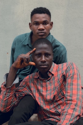 Two young men posing for a portrait.
