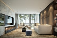 Modern living room with large windows and comfortable seating