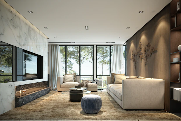 Living room with a stone fireplace and layered lighting