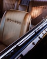 Interior of a classic car with tan seats.