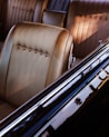 Interior of a classic car with tan seats.