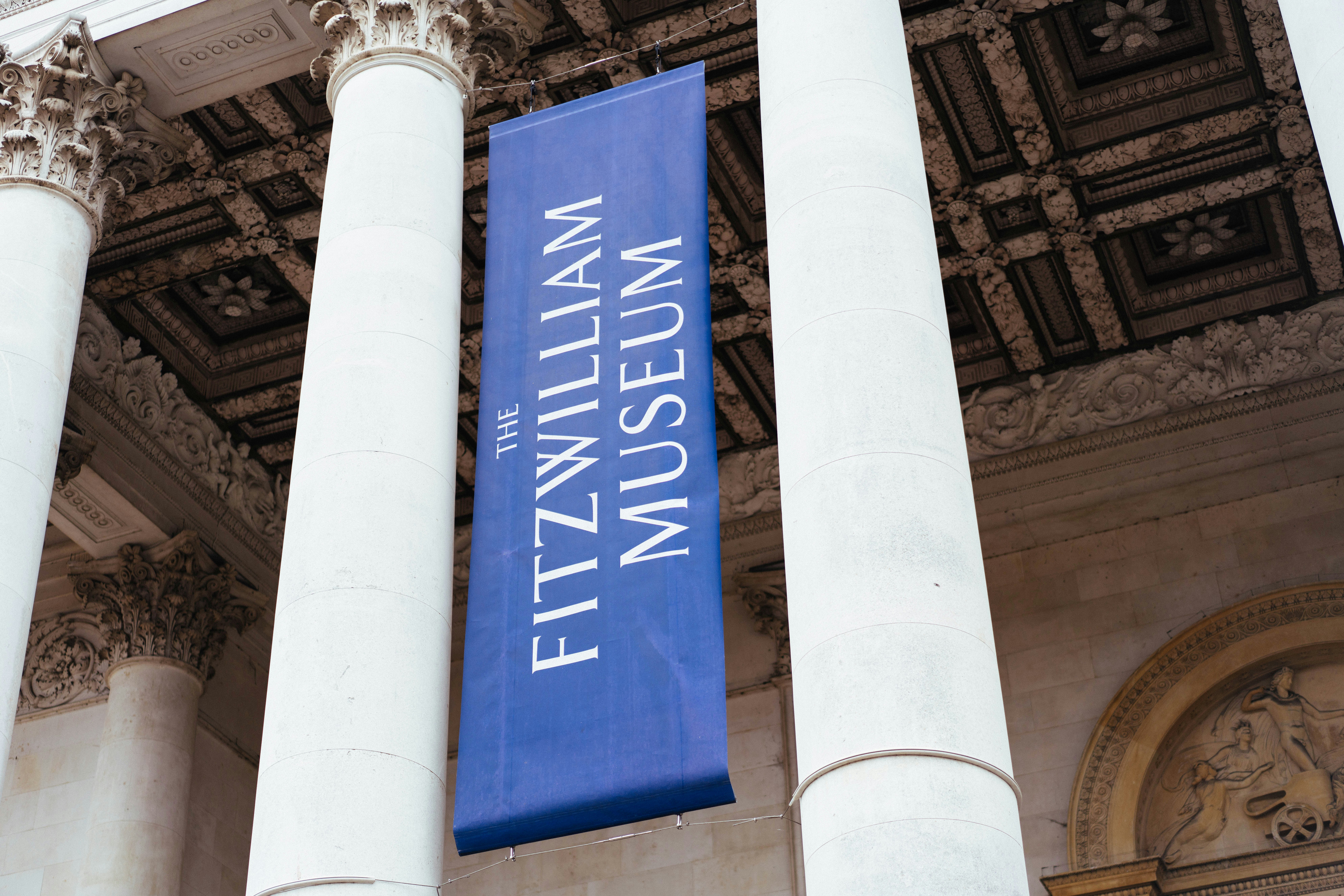 A blue banner for the fitzwilliam museum hangs.