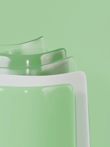 Abstract pastel green and white layered shapes