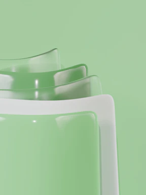 Abstract pastel green and white layered shapes