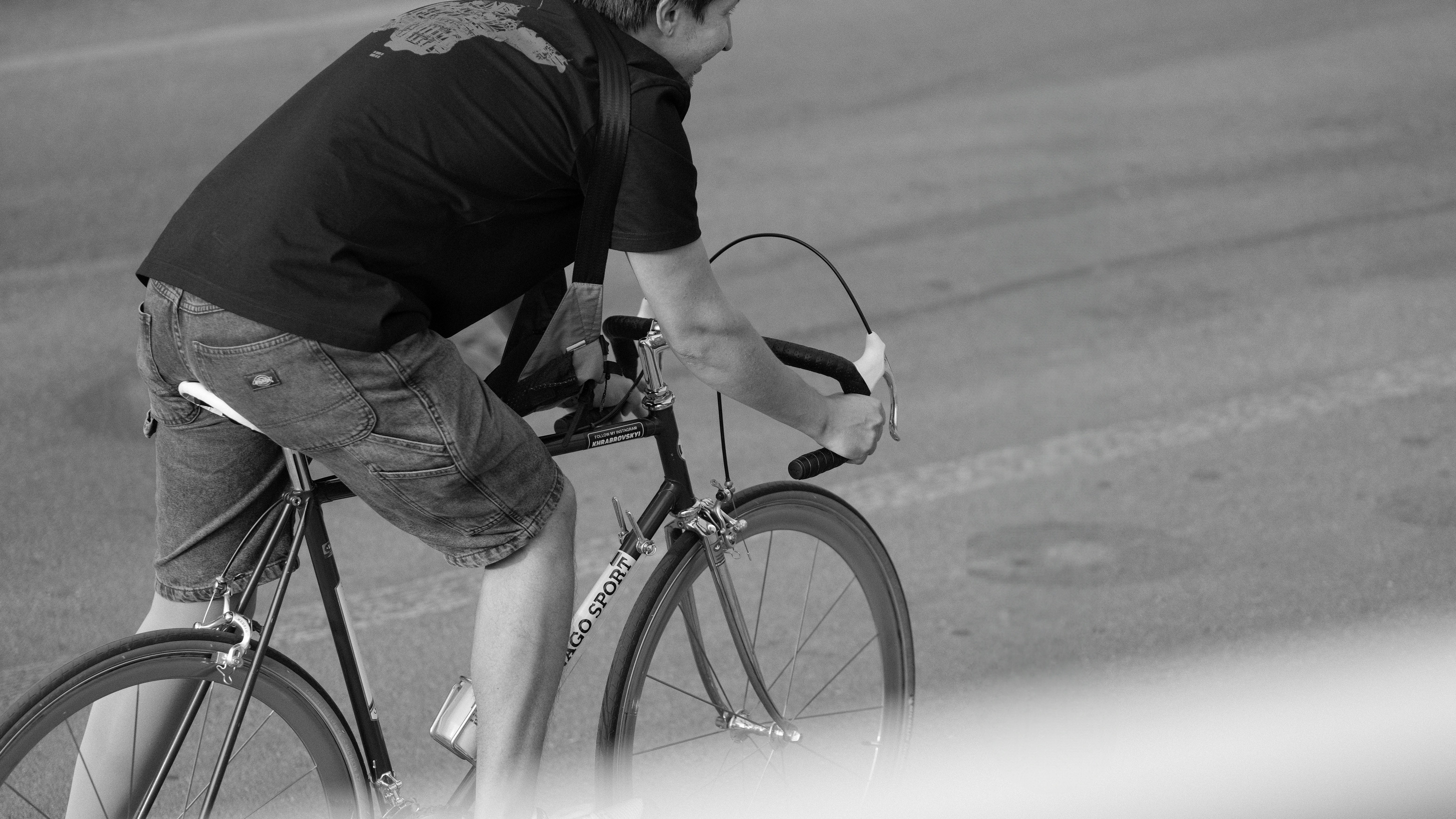 Man riding a bicycle on a paved road