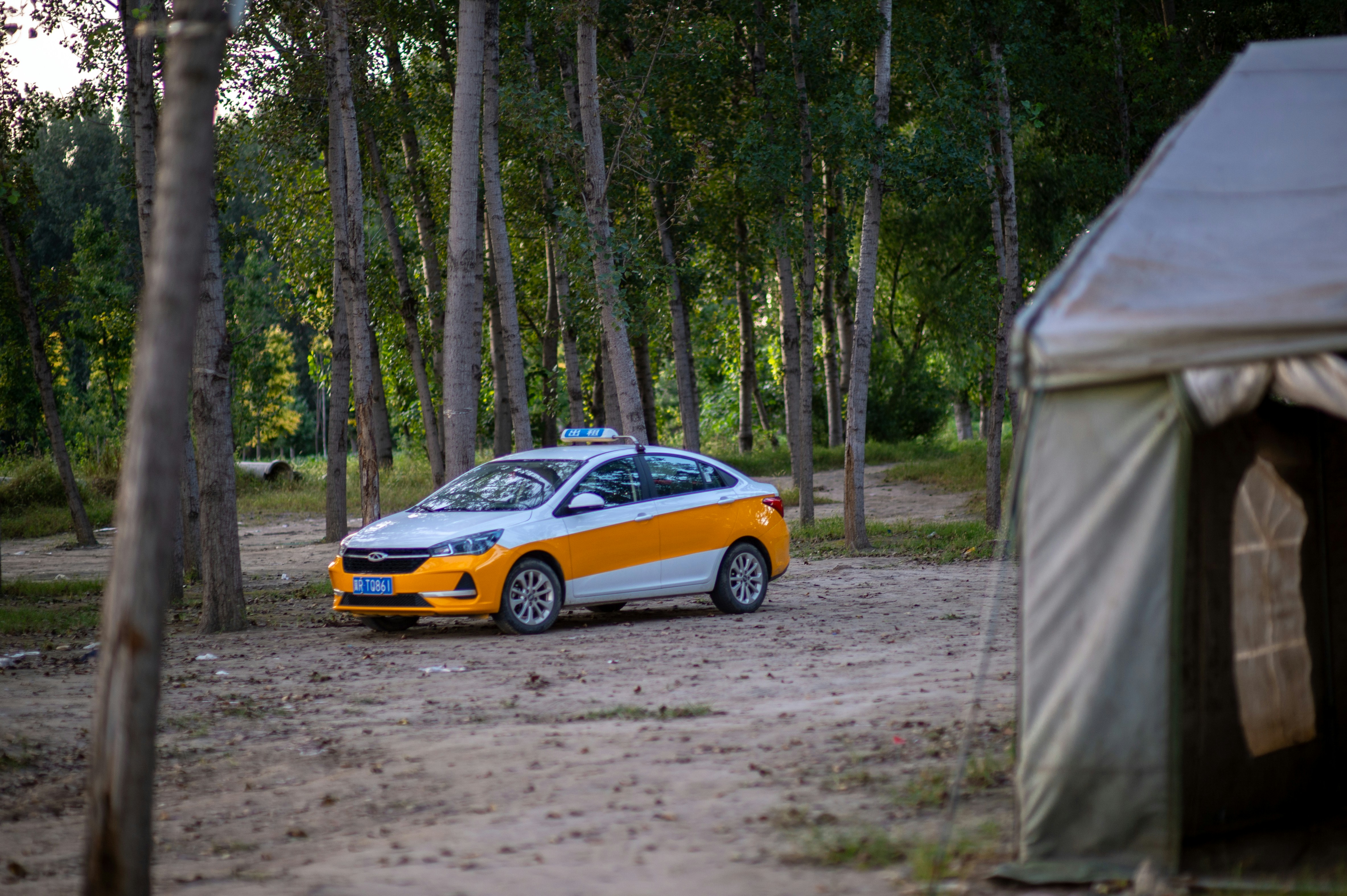 Electric cars parked and charging at a shopping center parking lot
