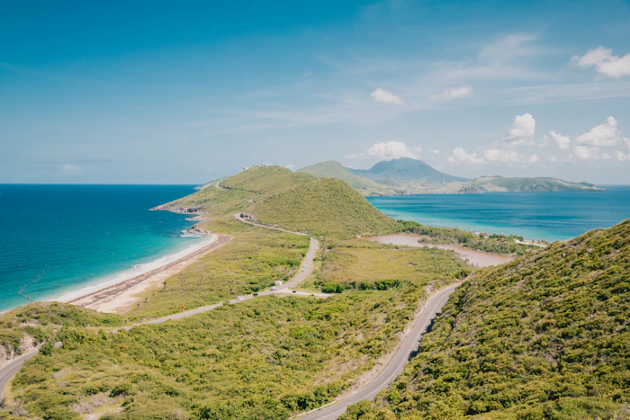 Coastal road winding along a Caribbean shoreline