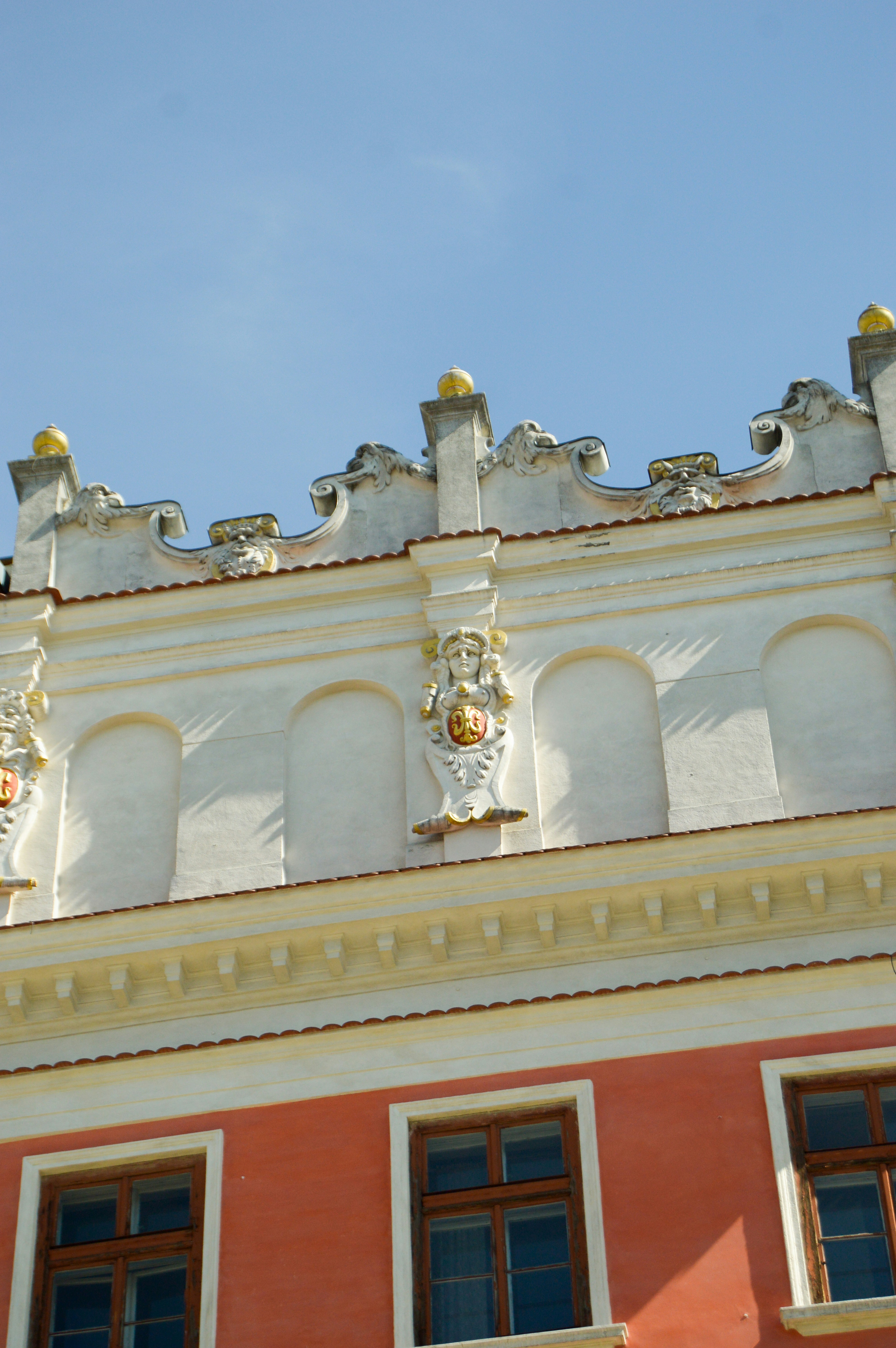 Ornate facade of an old building with arched windows