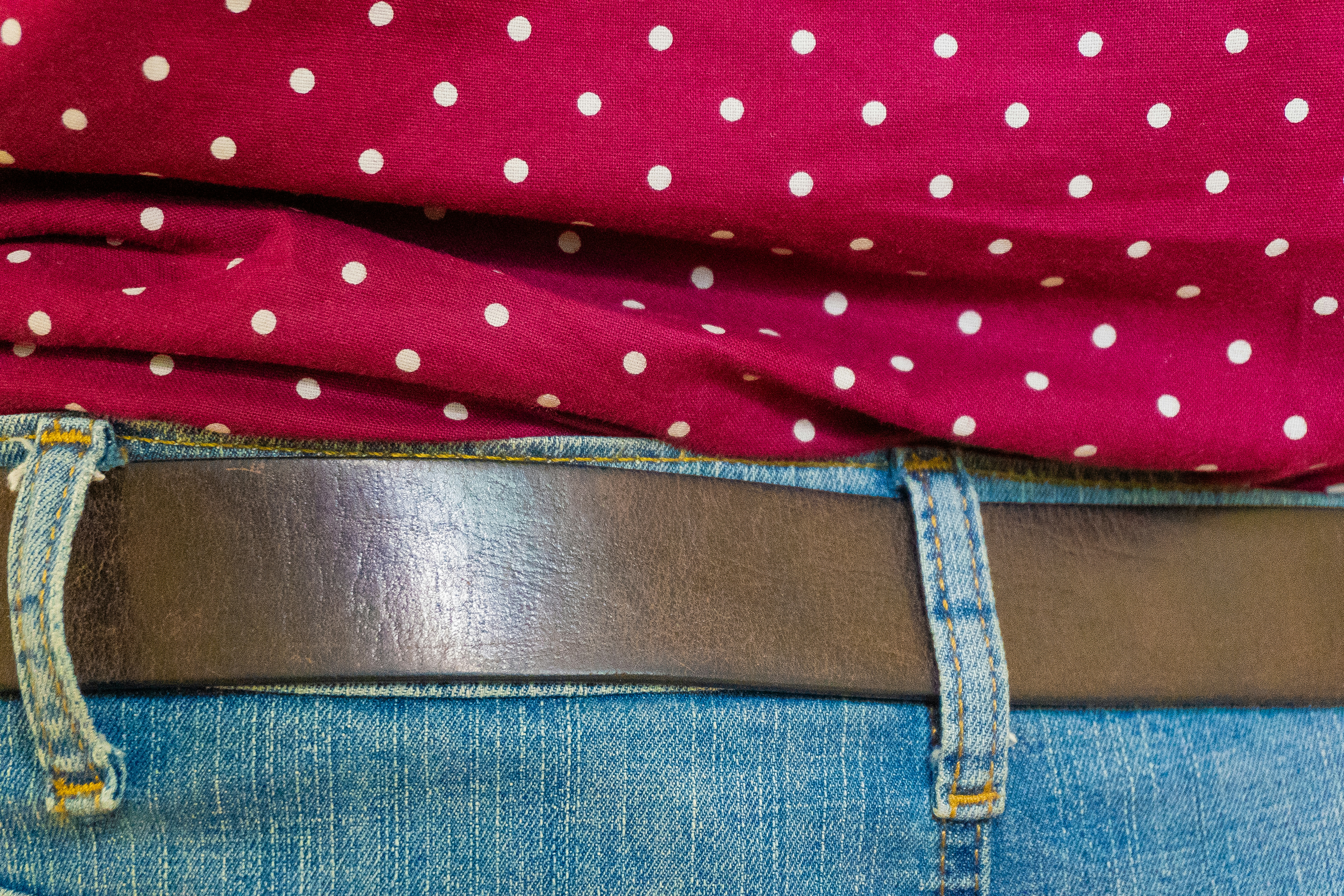 Close-up of a red polka dot shirt and jeans